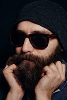 Handsome male big beard in glasses and hat photo