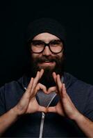 Handsome male big beard in glasses and hat photo