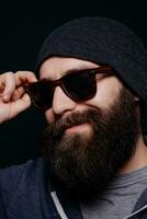 Handsome male big beard in glasses and hat photo