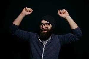 Handsome male big beard in glasses and hat photo