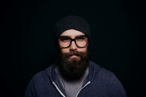 Handsome male big beard in glasses and hat photo