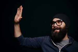 Handsome male big beard in glasses and hat photo