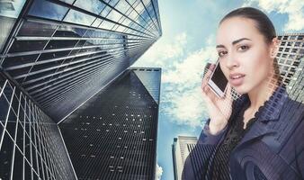 Double exposure of city and beautiful business woman folded her arms photo