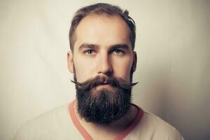 Portrait of tattooed bearded man photo