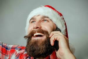 Santa talking on the phone isolated over  white background photo