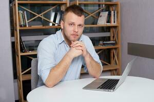 Hipster businessman working at his desk office photo