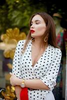 beautiful model look brunette female wearing white polka dots photo