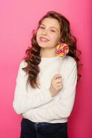 Woman with dental braces holding lollipop photo