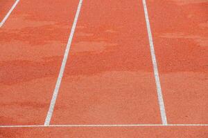 red runway with change markings for a relay race photo