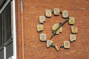clock on brick wall photo