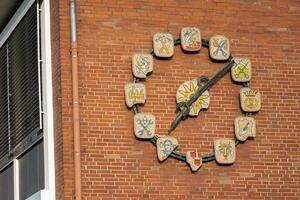 clock on brick wall photo