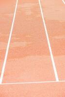 red runway with change markings for a relay race photo