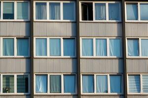 Detail of a high-rise building with windows from the 70s photo
