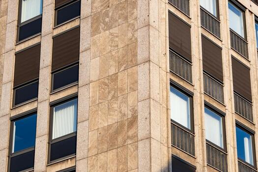 Detail of a high-rise building with windows from the 70s photo