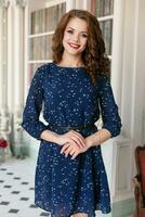 Beautiful pretty girl in blue sheath cocktail dress photo