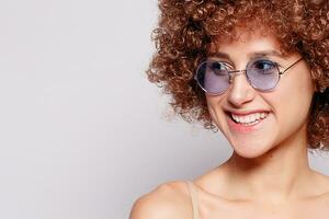 Portrait of smiling young woman with afro hairstyle photo