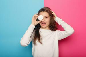 Woman with dental braces holding lollipop photo