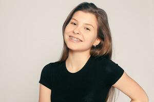 Portrait of teen girl showing dental braces. photo