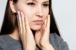 Teeth Problem. Woman Feeling Tooth Pain. photo