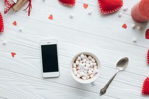 Valentines day concept. Hand make yarn red heart beside wooden block calendar set on Valentines date 14 February on table and bright room background. Happy valentine day. photo