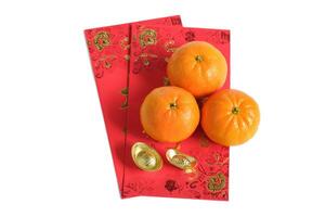 Happy New Year Chinese year of dragon 2024. Mandarin orange and gold ingots on red envelopes isolated on white background. photo