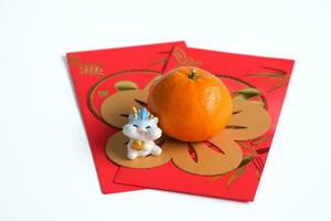 Happy New Year Chinese year of dragon 2024. Mandarin orange, dragon on red envelopes isolated on white background. photo