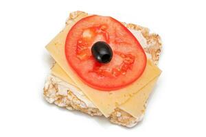 Rice Cake Sandwich with Tomato, Cheese and Olives Isolated on White. Easy Breakfast. Diet Food. Quick and Healthy Sandwiches. Crispbread with Tasty Filling. Healthy Dietary Snack Isolation photo