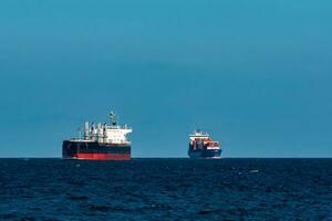 Black bulker ship. Logistics and merchandise transportations photo