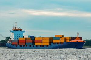 Blue container ship. Global logistics and merchandise transfer photo