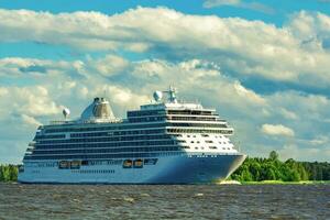 Big white cruise ship sailing to the Baltic sea at clear day photo