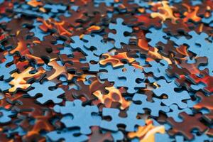 Top View of Mixed Peaces of a Jigsaw Puzzle Texture Background photo