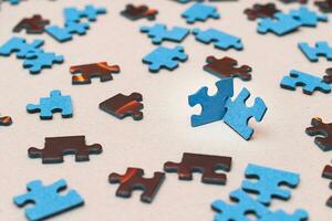 Mixed Peaces of a Colorful Jigsaw Puzzle Strategy and Solving Problem Concept photo