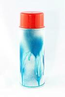 Blue Spray Paint Can on White Background CloseUp Shot photo