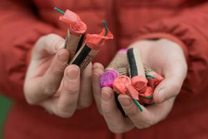 Man Holding Firecrackers in his Hand. Guy Getting Ready for New Year Fun CloseUp Shot photo