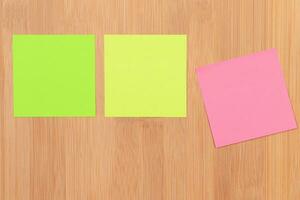 Colored Sticky Notes with Copyspace Pinned to the Wooden Message Board. To Do List Reminder in Office. Blank Memo Sticker at Work Template. Empty Checklist Mockup photo