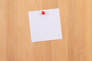 White Sticky Note with Copyspace Pinned to the Wooden Message Board. To Do List Reminder in Office. Blank Memo Sticker at Work Template. Empty Checklist Mockup photo