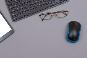 Top View of Workplace. Digital Gadgets Lying on Grey Table Flat Lay photo