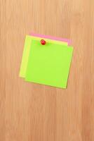 Colored Sticky Notes with Copyspace Pinned to the Wooden Message Board. To Do List Reminder in Office. Blank Memo Sticker at Work Template. Empty Checklist Mockup photo