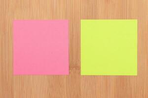 Colored Sticky Notes with Copyspace Pinned to the Wooden Message Board. To Do List Reminder in Office. Blank Memo Sticker at Work Template. Empty Checklist Mockup photo