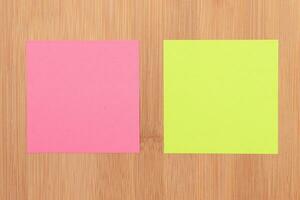 Colored Sticky Notes with Copyspace Pinned to the Wooden Message Board. To Do List Reminder in Office. Blank Memo Sticker at Work Template. Empty Checklist Mockup photo