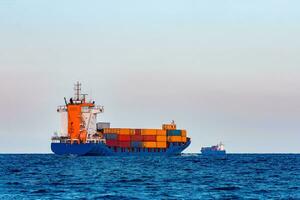 Blue container ship. Global logistics and merchandise transfer photo