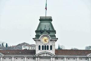 the clock tower of the train station in milan, italy photo