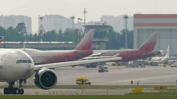 MOSCOW, RUSSIAN FEDERATION - JULY 30, 2021. Widebody Boeing 777, VP-BJJ of Nordwind taxiing at Sheremetyevo airport. Passenger aircraft on the taxiway. Tourism and travel concept video