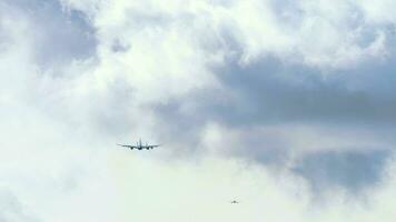 Row of planes in the sky. Rear view of a jet plane gaining altitude. Passenger plane take off. Departure flight video