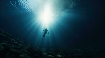 ai generado buzo descendente dentro el profundo azul mar, con luz de sol filtración mediante el agua foto