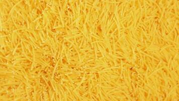 Background of Uncooked Noodles that Rotating Counterclockwise Top View, CloseUp. Texture of Dry Vermicelli Turning Around. Raw Pasta Left Rotation video