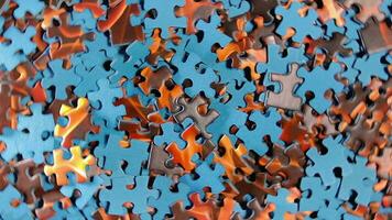 Background of Colored Puzzle Pieces that Rotating Counterclockwise Top View. Texture of Incomplete Red and Blue Jigsaw Puzzle Left Rotation video