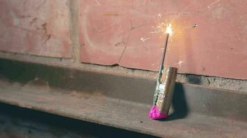 Firecracker Was Lighted Up With a Gas Lighter then Explode Against a Brick Wall. Many Small Particles Flew in a Different Directions Static Shot video