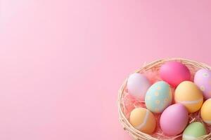 AI generated Colorful Easter eggs arranged in a basket on a pastel pink background with copy space. photo