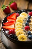 ai generado un sano desayuno cuenco lleno con vistoso frutas y granos foto